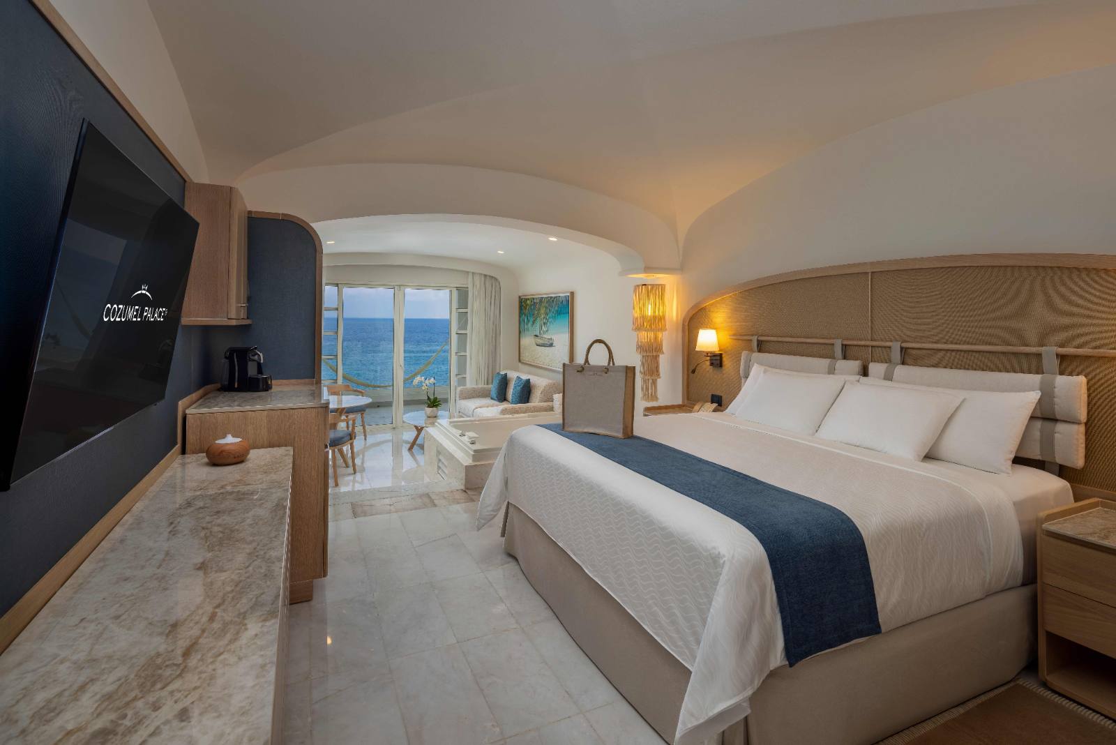 Honeymoon Suite: king bed, whirlpool, hammock, water filling the doorway
