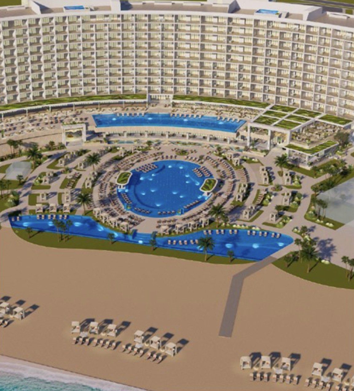 The pool complex from above: a rooftop-level pool behind, the round main pool in the middle, two beach-side pools in front