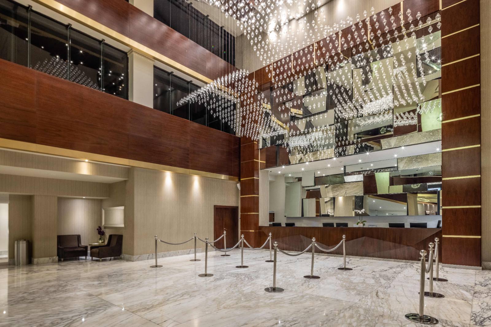 Reception: marble, a crystal ceiling, and a queue line that rarely fills