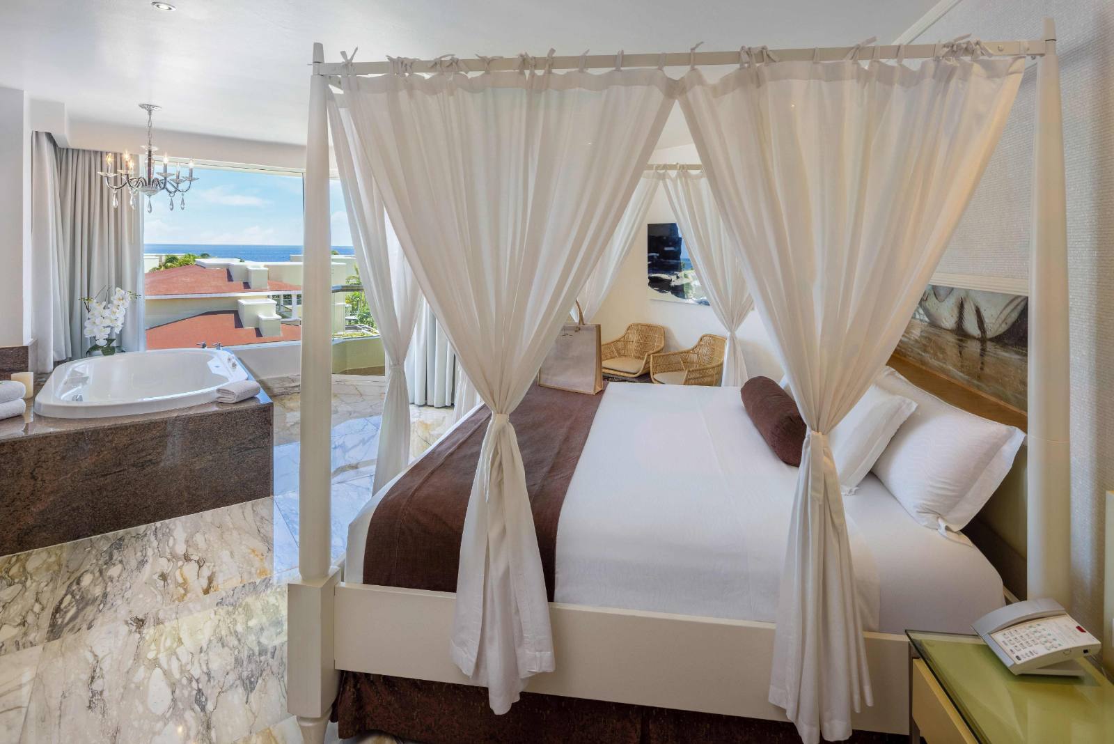 Master bedroom: king bed, marble floors, doors to the terrace