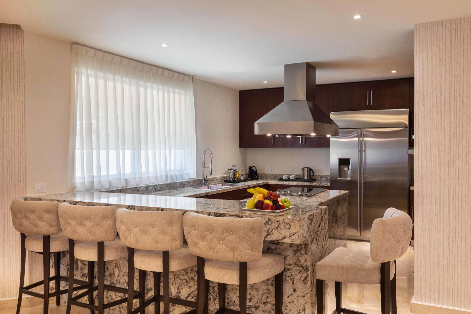 A full kitchen in the villa, which changes how a long stay works