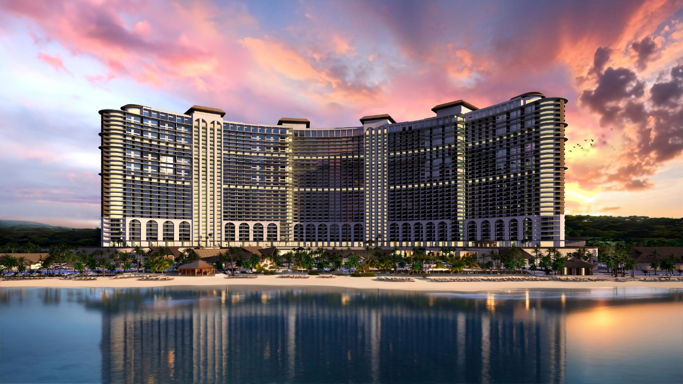 The full curve of the building from the water: arcade at ground level, rooms stacked above