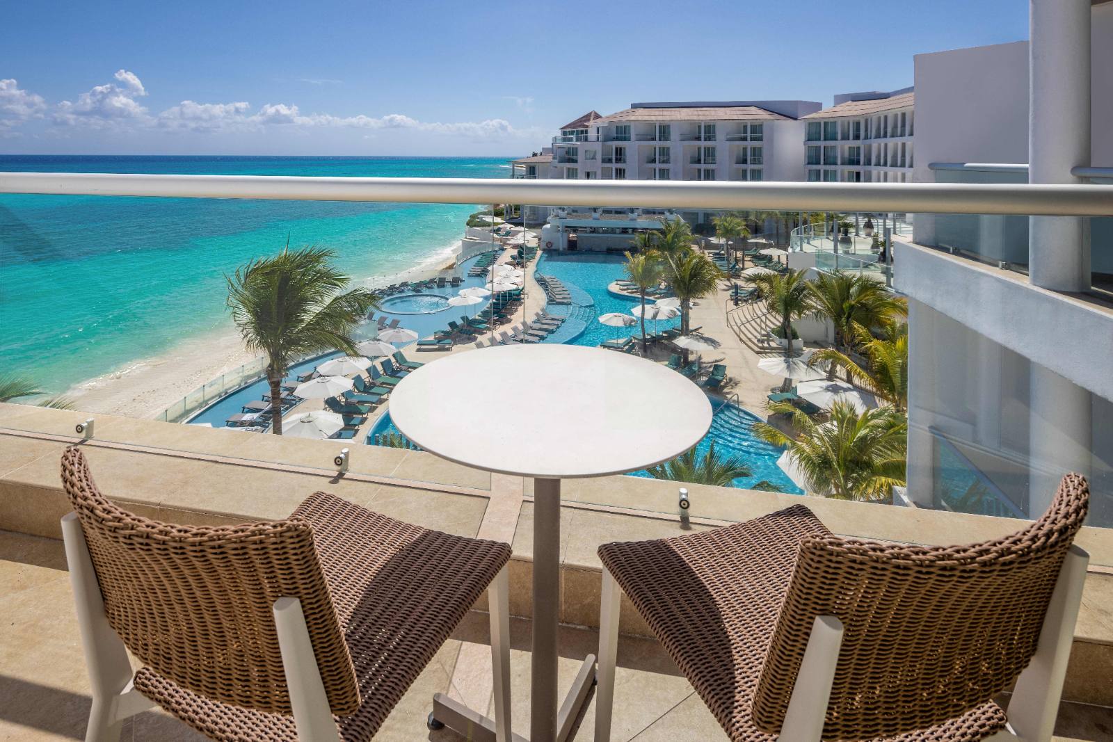 What an Ocean View balcony actually looks at: the pool, the sand, then open water