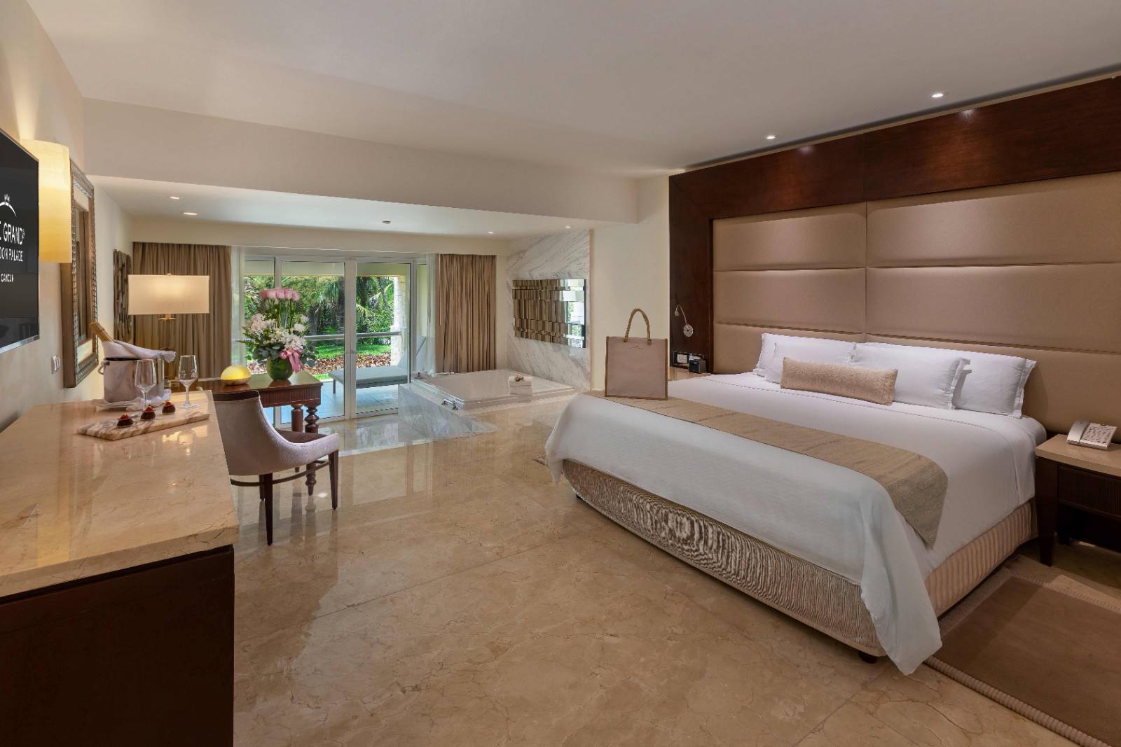 Honeymoon Suite: king bed, marble whirlpool, doors onto the garden