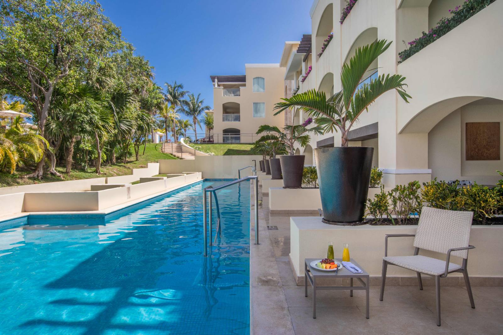 Swim-Up Suite: ground floor, private steps into a shared lane pool